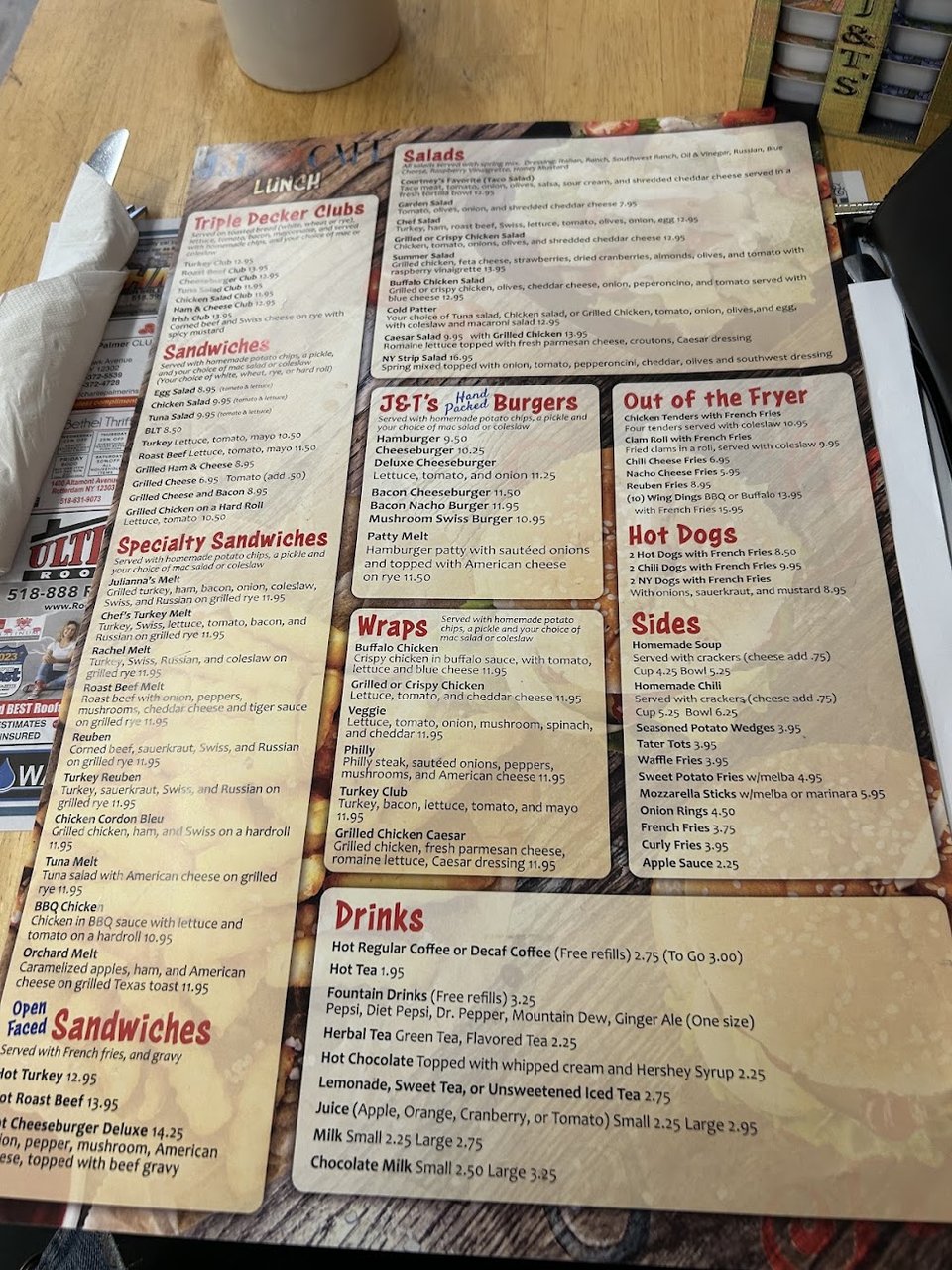 Breakfast and lunch menu laid out on a table.